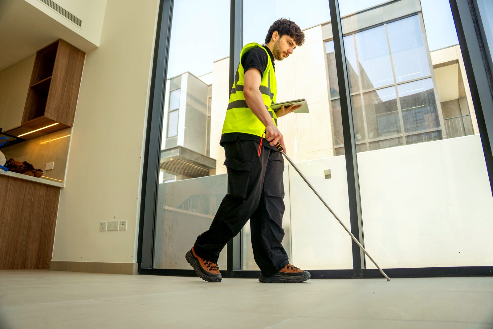An Inspecto inspector checking floor levels and tile falls during a Dubai handover inspection