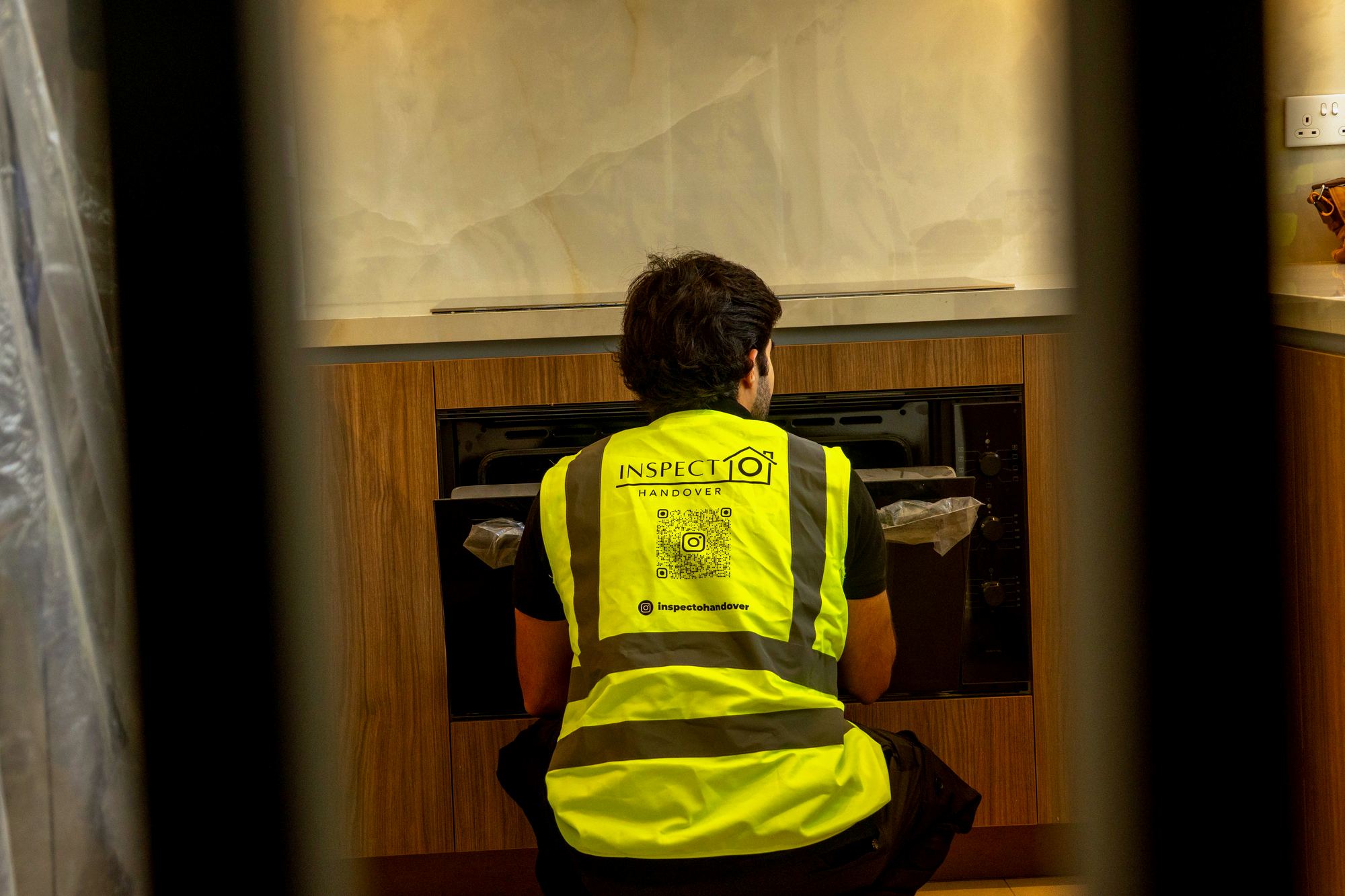 An Inspecto inspector testing a built-in oven during a Dubai handover inspection