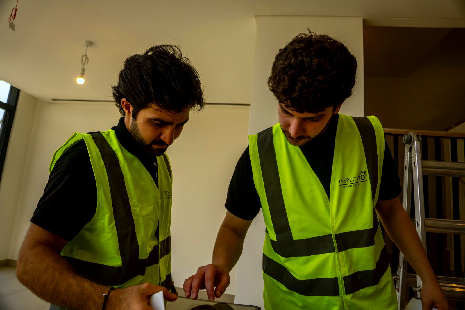 Inspecto Handover inspector in Dubai: two inspectors comparing findings on site before the report is written
